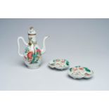 A Chinese famille rose ewer and cover and a pair of peach-shaped saucers with floral design, 19th C.