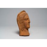 An Etruscan-Roman terracotta votive male half-head, Italy, presumably 4th/3rd C. B.C.