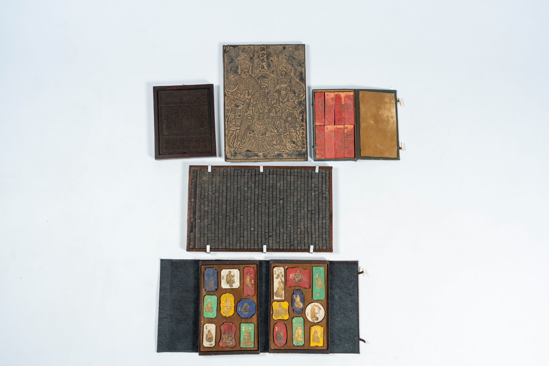 Two Chinese boxes with inkstones, a tea block, a printing plate and a type case, 20th C.