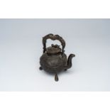 A Chinese tripod bronze teapot and cover with dragon relief design and double gourds, ca. 1900