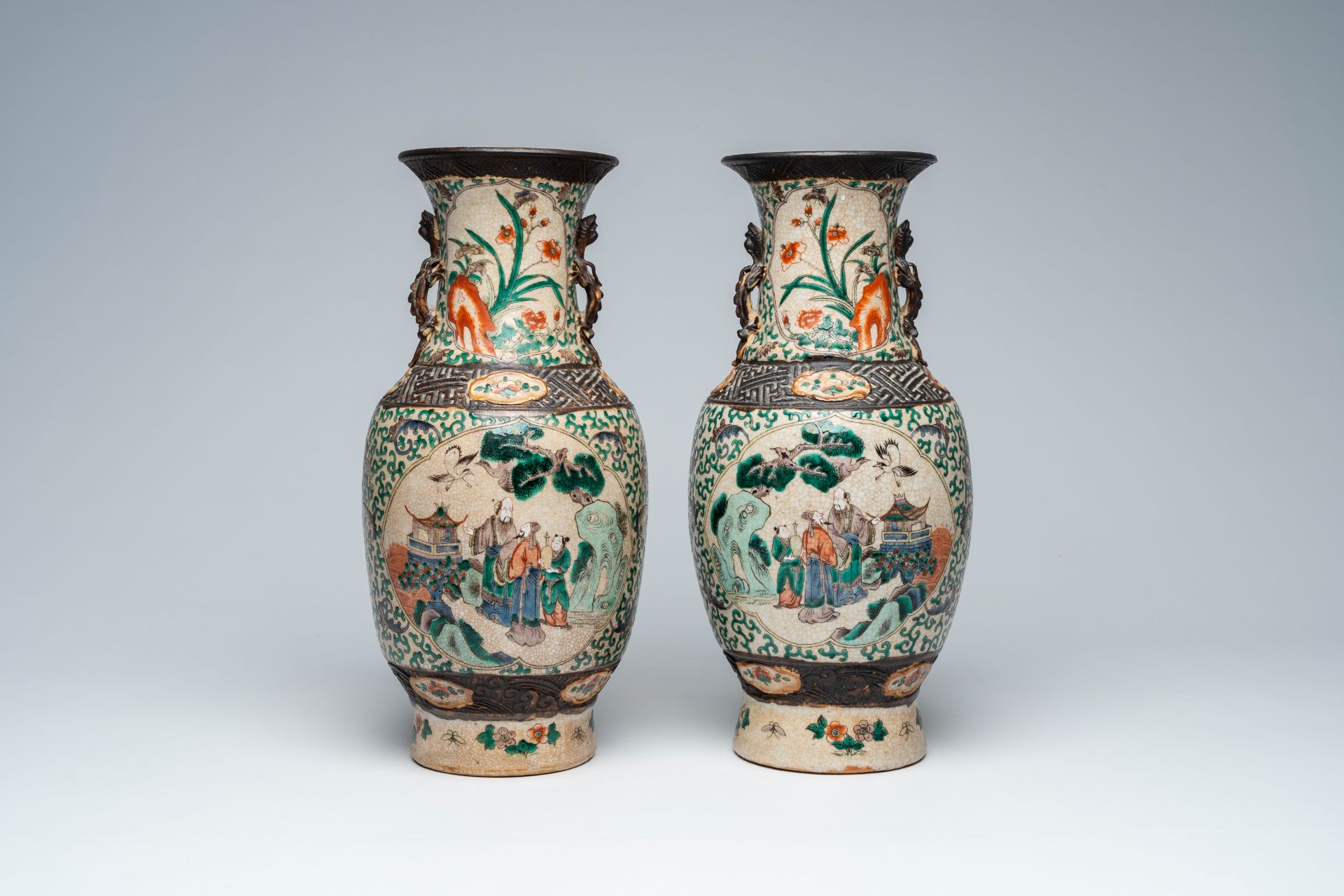 A pair of Chinese Nanking crackle glazed famille verte 'Immortals' vases, 19th C. - Image 3 of 6