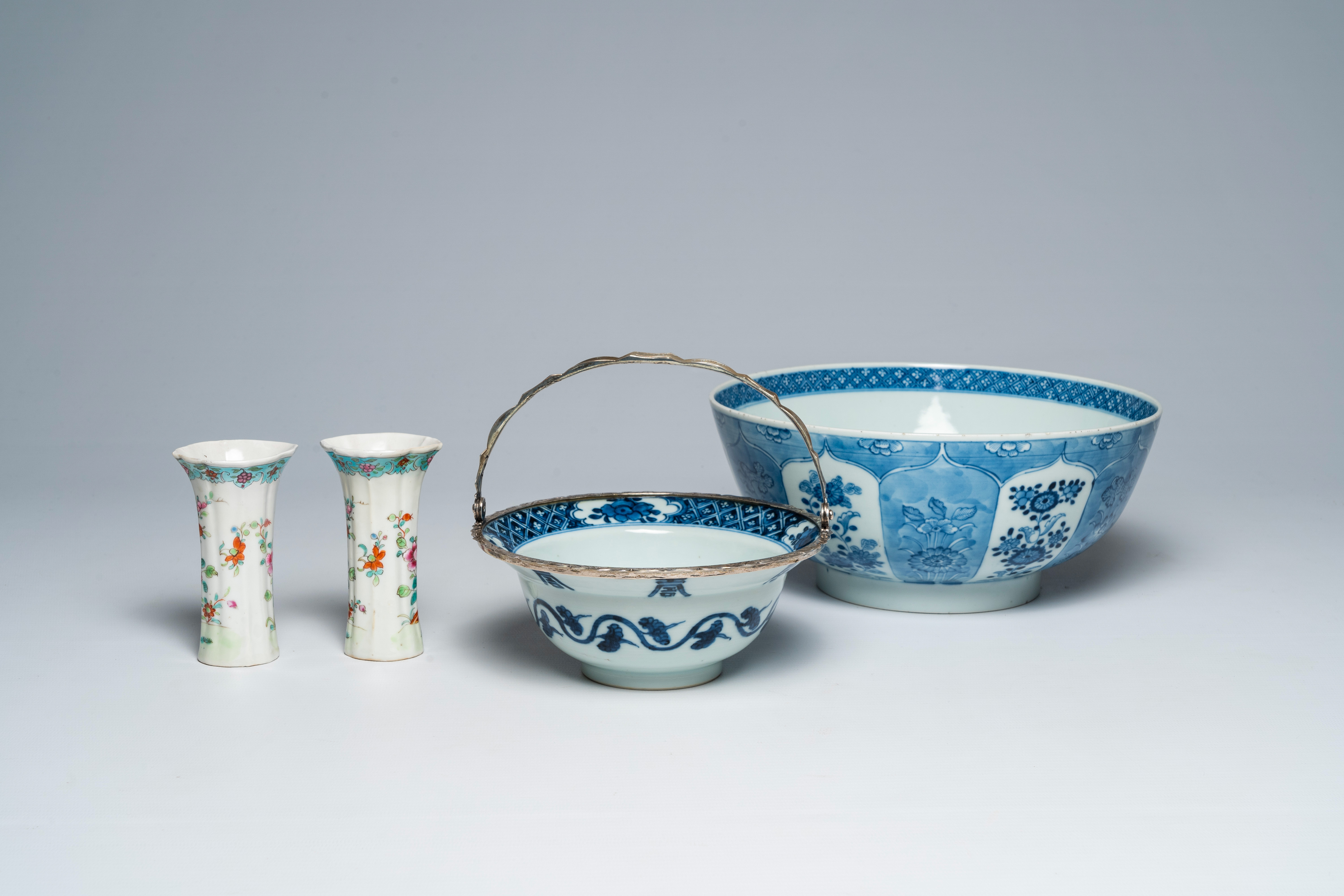 Two Chinese blue and white bowls and a pair of famille rose vases, Kangxi/Qianlong