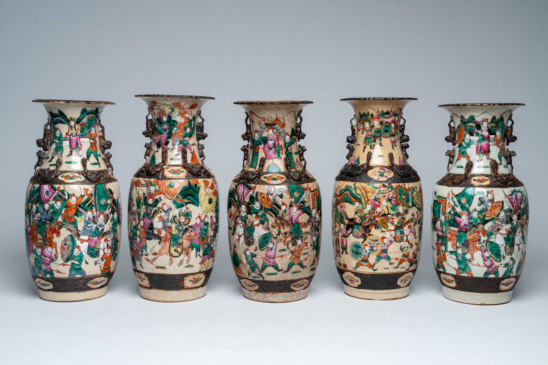 Five Chinese Nanking crackle glazed famille rose 'warrior' vases, 19th C.