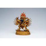 A Sino-Tibetan gilt bronze figure of Mahakala and his consort Yab-Yum, 19/20th C.