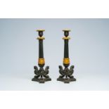 A pair of French gilt and patinated bronze 'griffins' candlesticks, 19th C.