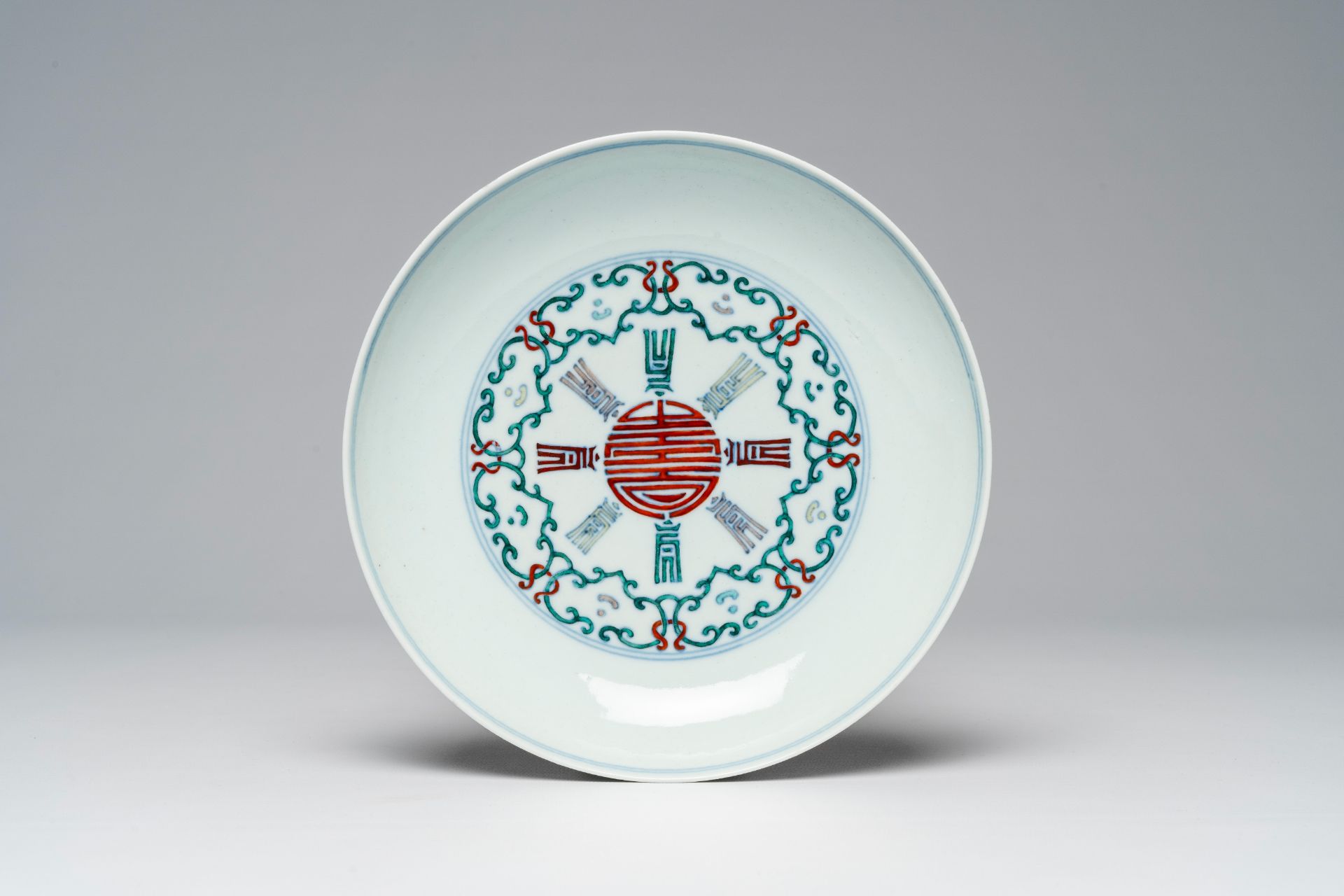 A Chinese doucai 'Shou' plate, Qianlong mark, 19th/20th C.