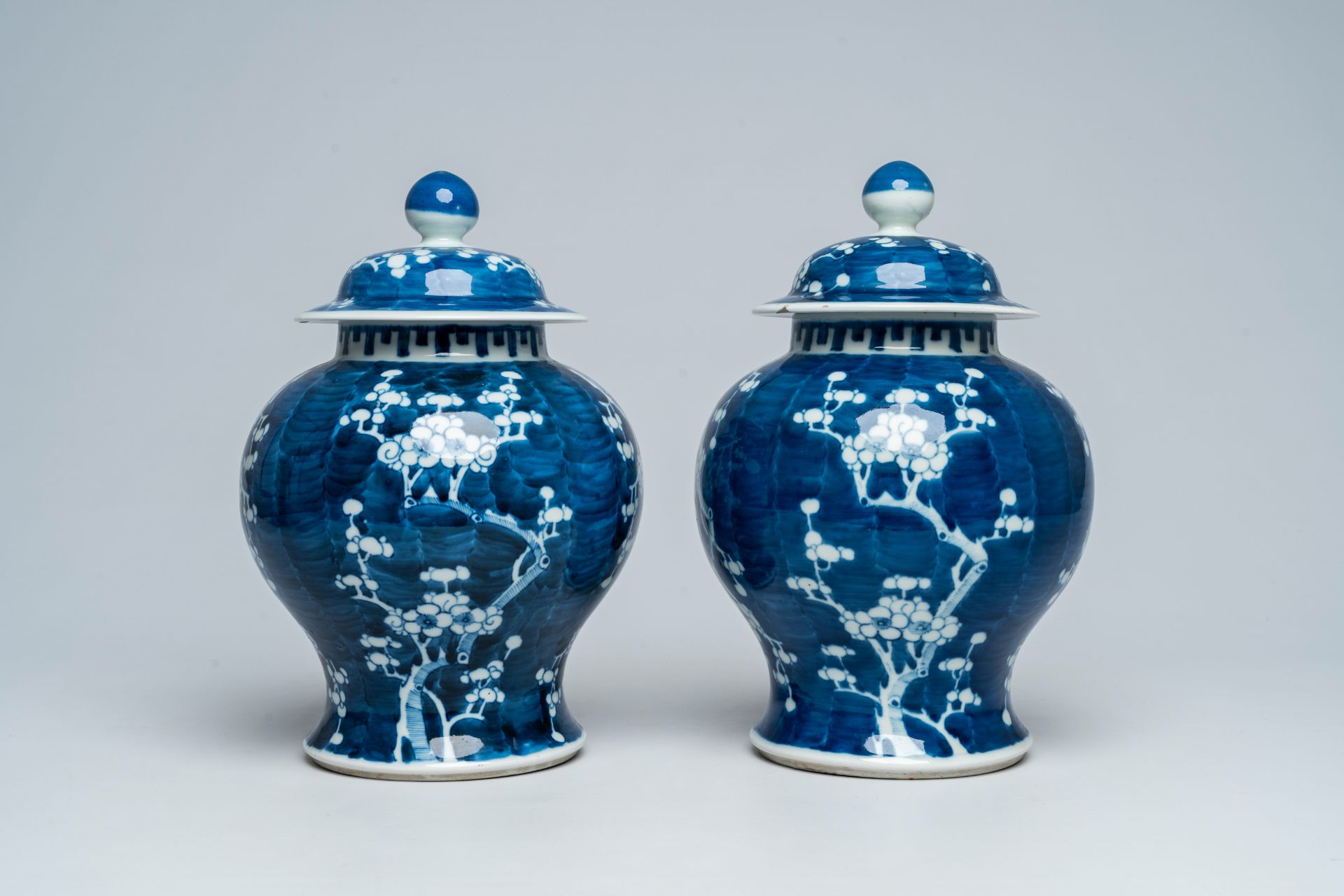 A pair of Chinese blue and white prunus on cracked ice ground vases and covers, 19th C. - Image 4 of 6