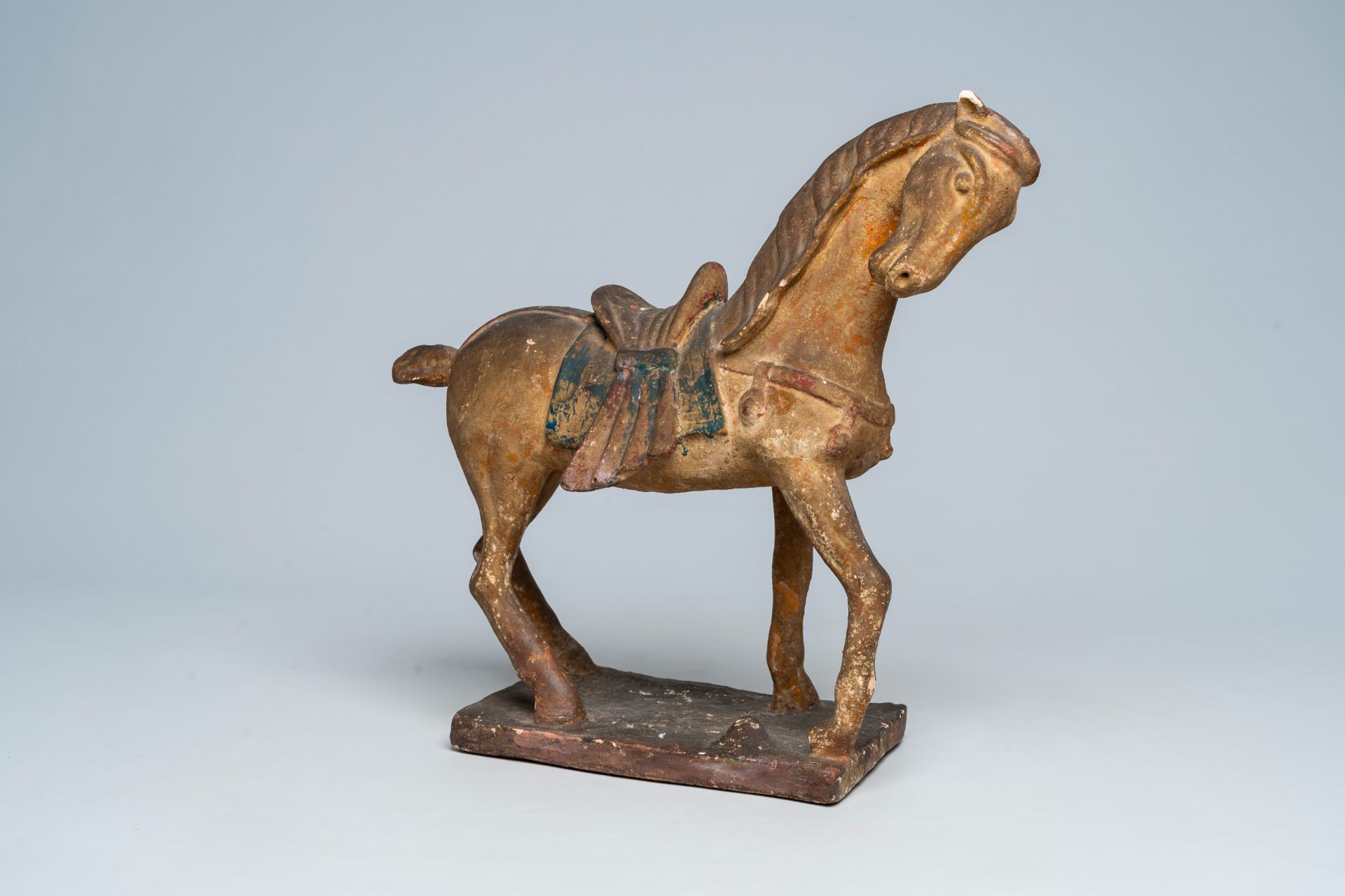 A Chinese polychrome painted Tang style pottery model of a horse, 19th/20th C.