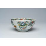 A Chinese famille verte bowl with antiquities and floral design, Ding mark, Kangxi