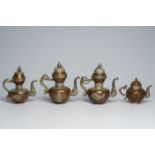 Four Tibetan copper ewers and covers with relief design, 19th/20th C.