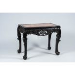 A Chinese open worked hardwood table with marble top, 19th C.