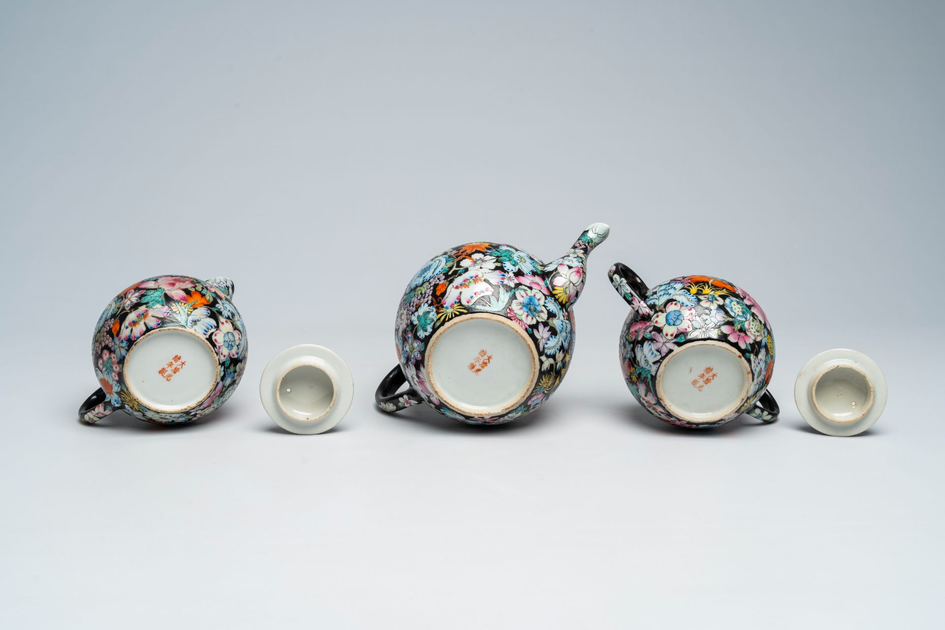 A Chinese fifteen-piece famille rose 'millefleurs' tea set with matching case, Guangxu mark, 20th C. - Image 11 of 20