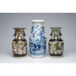 A pair of Chinese Nanking crackle glazed famille rose 'warrior' vases and a blue and white 'phoenix'