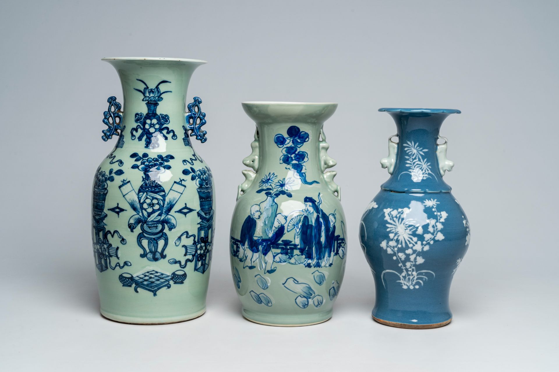 A Chinese slip-decorated blue ground vase with floral design and two blue and white celadon ground v