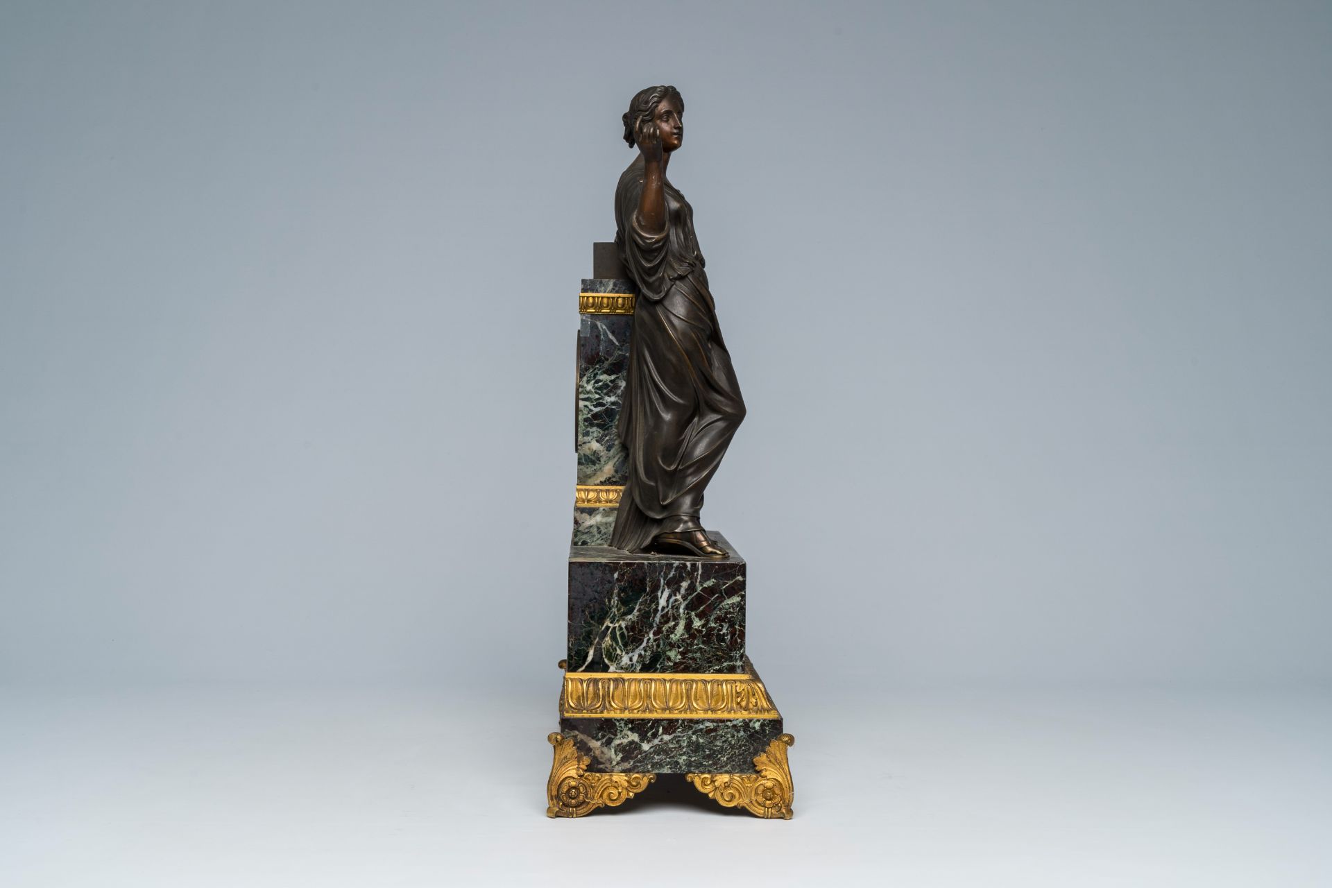 A French gilt and patinated bronze mounted marble mantel clock with an elegant lady, 19th C. - Image 6 of 9