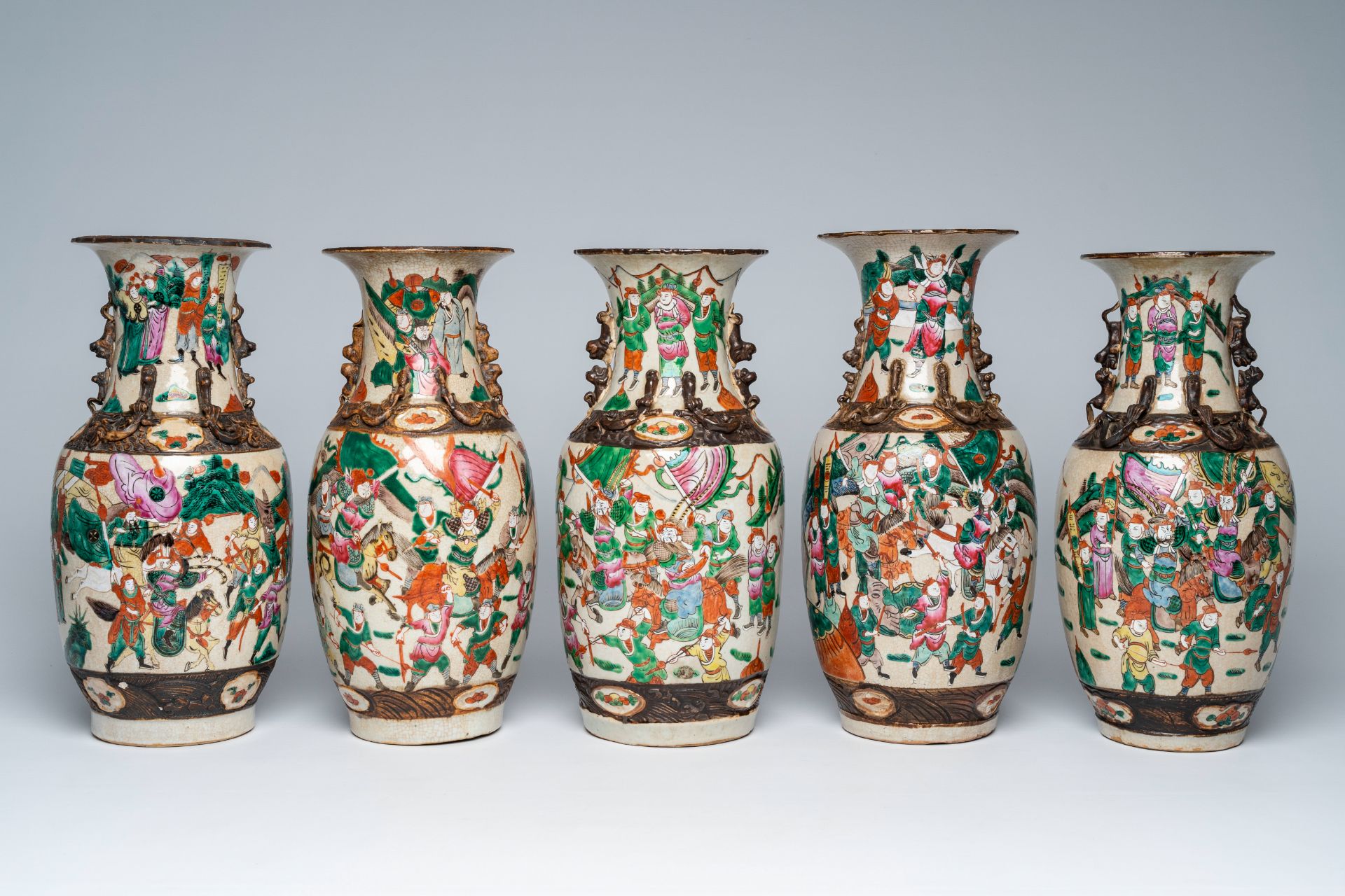 Five Chinese Nanking crackle glazed famille rose 'warrior' vases, 19th/20th C.