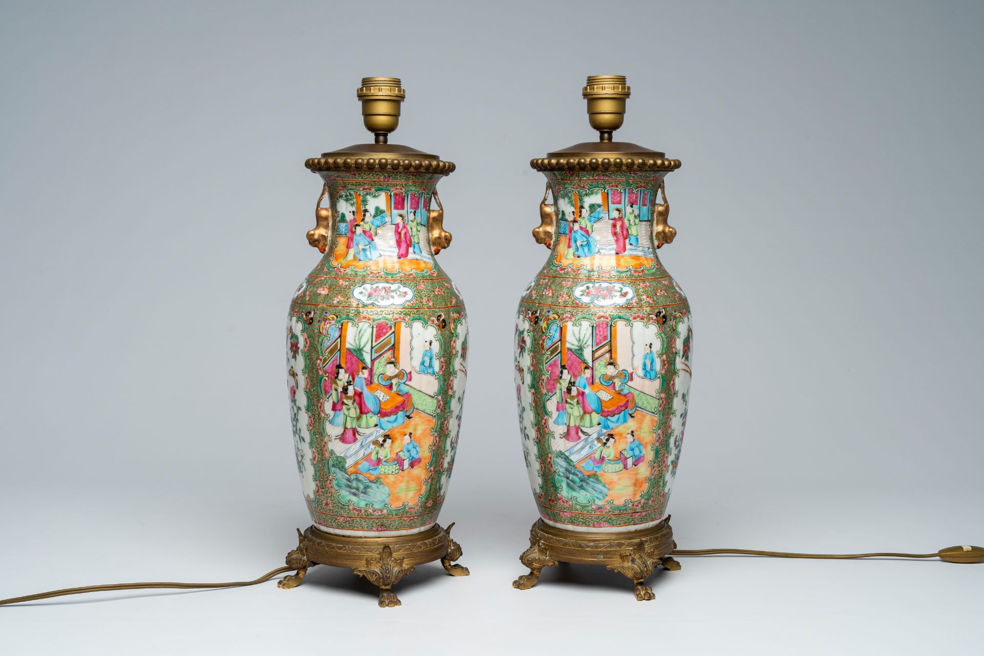 A pair of Chinese Canton famille rose vases with palace scenes mounted as lamps, 19th C. - Image 4 of 7
