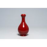 A Chinese monochrome copper red garlic head vase, Qianlong mark, 19th/20th C.