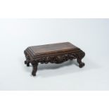 A Chinese rectangular hardwood 'dragons and bats' kang table, ca. 1900