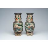 A pair of Chinese Nanking crackle glazed famille verte 'Immortals' vases, 19th C.