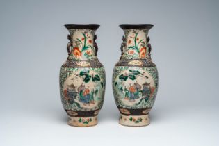 A pair of Chinese Nanking crackle glazed famille verte 'Immortals' vases, 19th C.