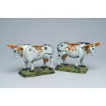 A pair of Dutch Delft partly cold painted polychrome cows, 18th C.