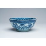 A Chinese blue and white bowl with a dromedary and warriors in a landscape and a medallion with a dr