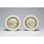 A pair of Chinese famille rose and gilt 'animated landscape' plates, Qianlong