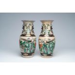 A pair of Chinese Nanking crackle glazed famille verte vases with a bird among blossoming branches,