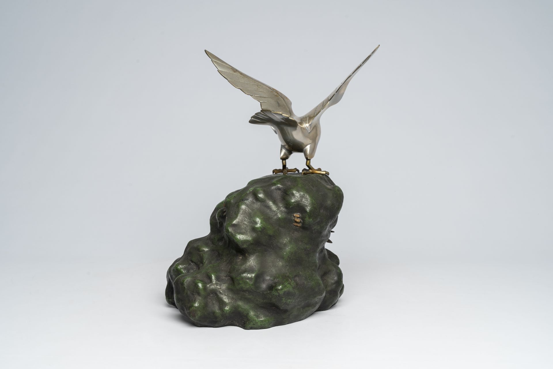 A Japanese patinated and silver-plated metal okimono of an eagle on a rock, signed Hidemasa, 20th C. - Image 4 of 17