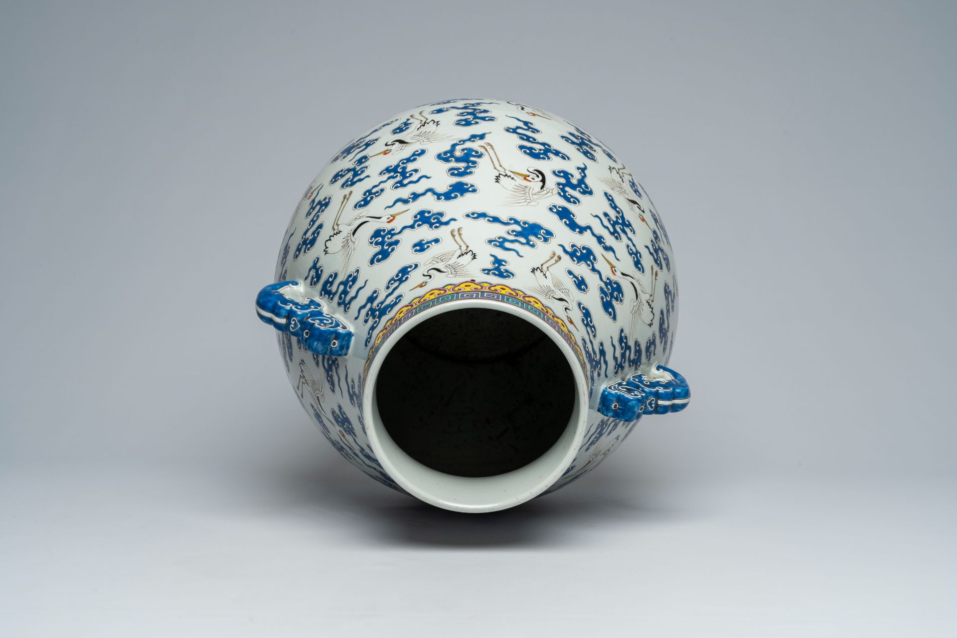 A Chinese famille rose 'hu' vase with cranes between clouds, Qianlong mark, 20th C. - Image 5 of 6