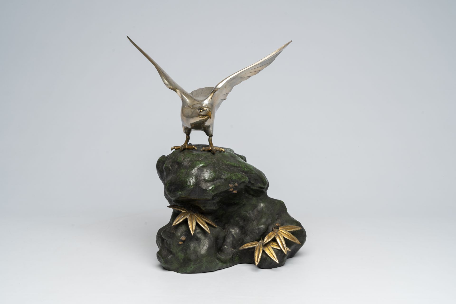 A Japanese patinated and silver-plated metal okimono of an eagle on a rock, signed Hidemasa, 20th C. - Image 2 of 17
