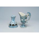 A French polychrome earthenware helmet-shaped jug and an openworked blue and white vase with floral