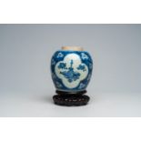 A Chinese blue and white 'antiquities' jar on wood stand, Kangxi