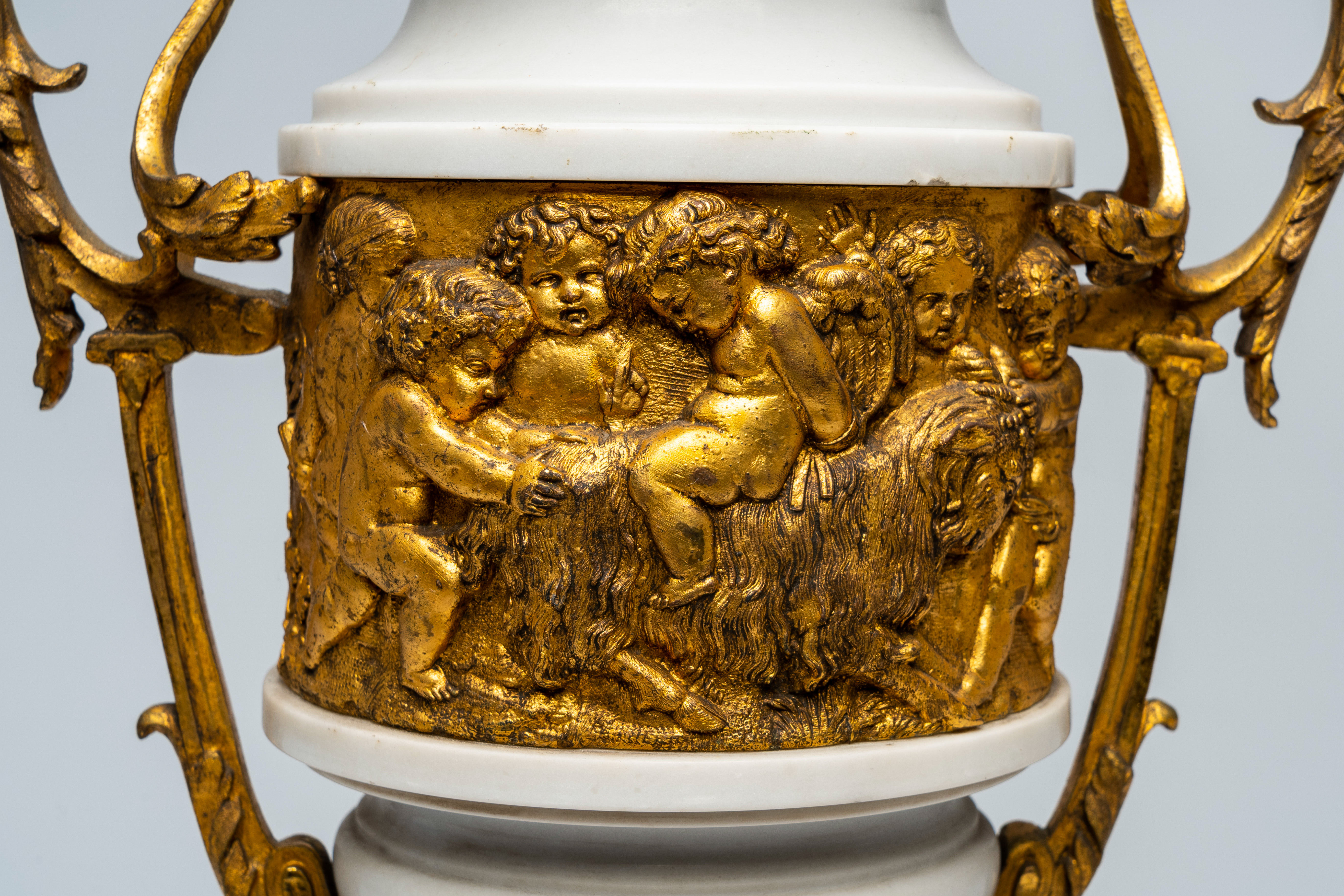 A pair of French gilt mounted white marble vases with relief design of putti, goats and Bacchus them - Image 7 of 7