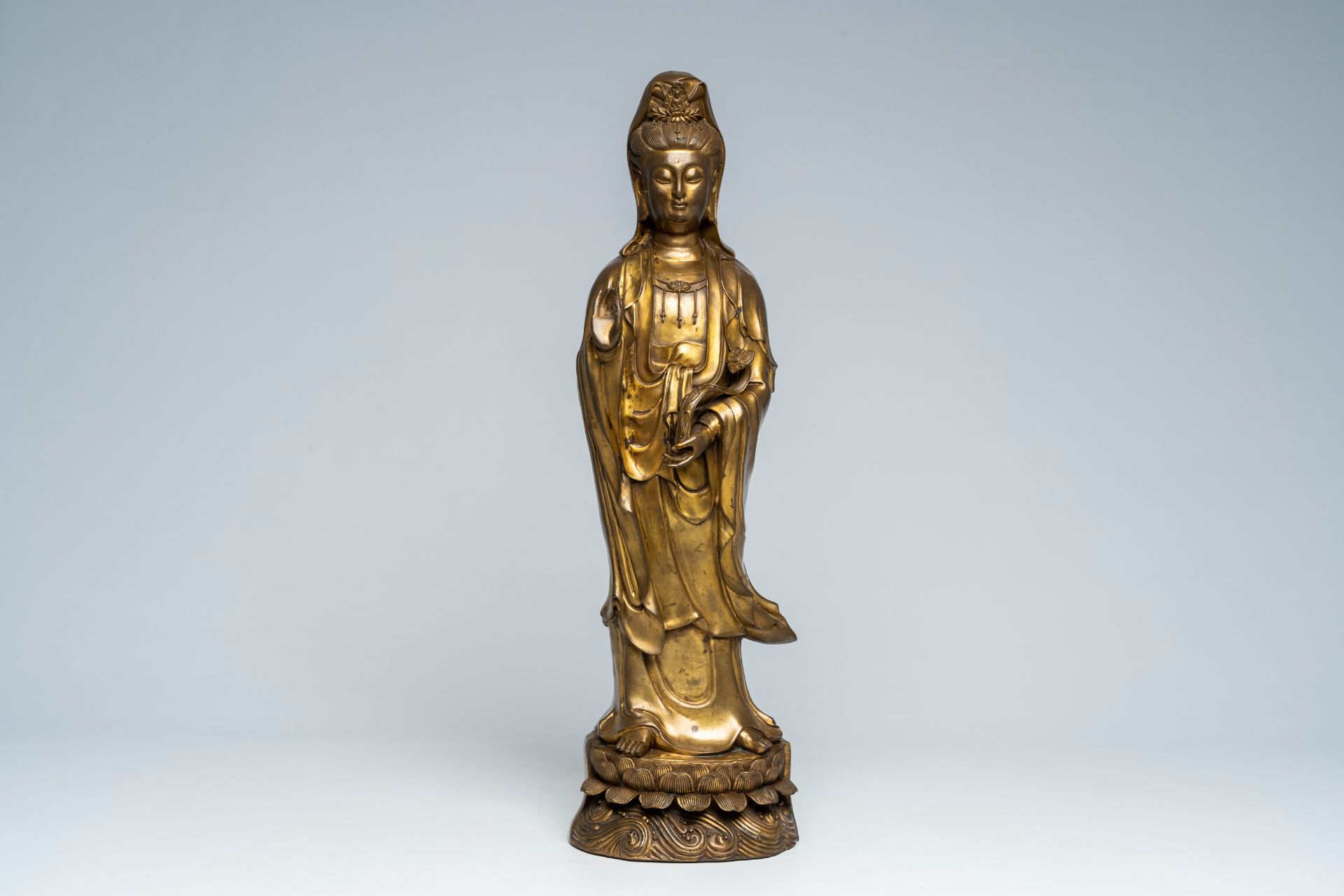 A large Chinese gilt copper sculpture of a standing Guanyin with ruyi sceptre on a lotus throne, Rep - Image 2 of 7