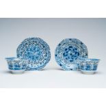 A pair of Chinese blue and white cups and saucers with floral design, Kangxi mark, 19th C.
