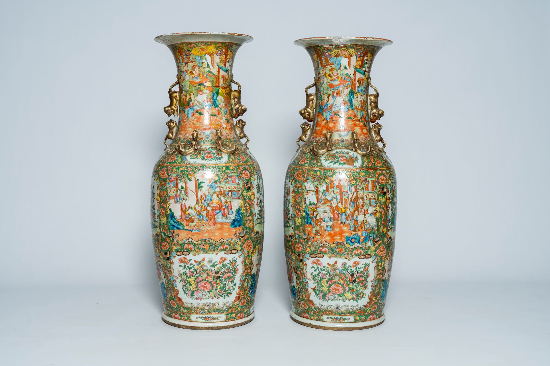 A pair of large Chinese Canton famille rose vases with palace scenes and floral design, 19th C. - Image 3 of 6