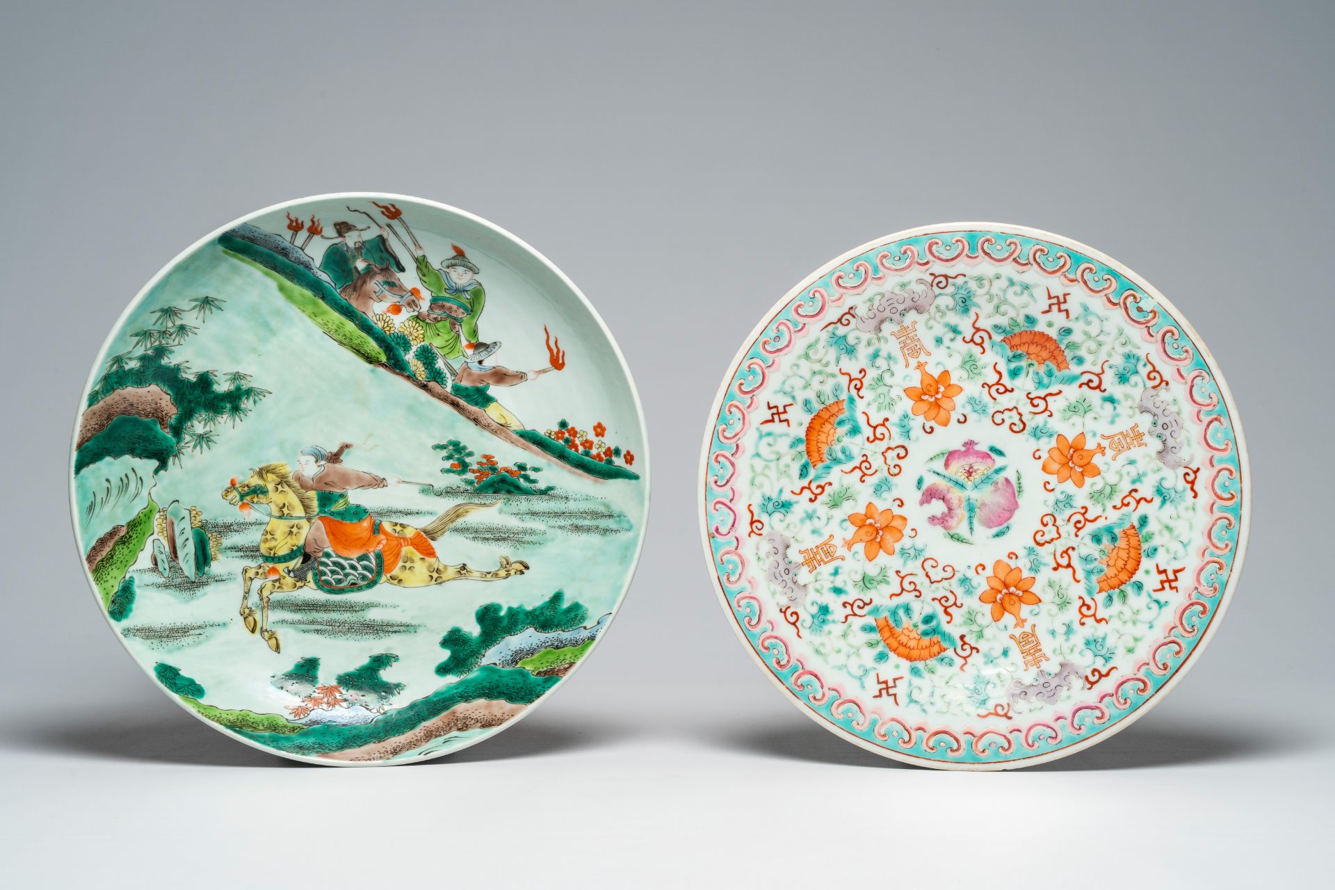 A Chinese famille verte 'horse rider' charger and a famille rose 'Shou' dish, 19th C.