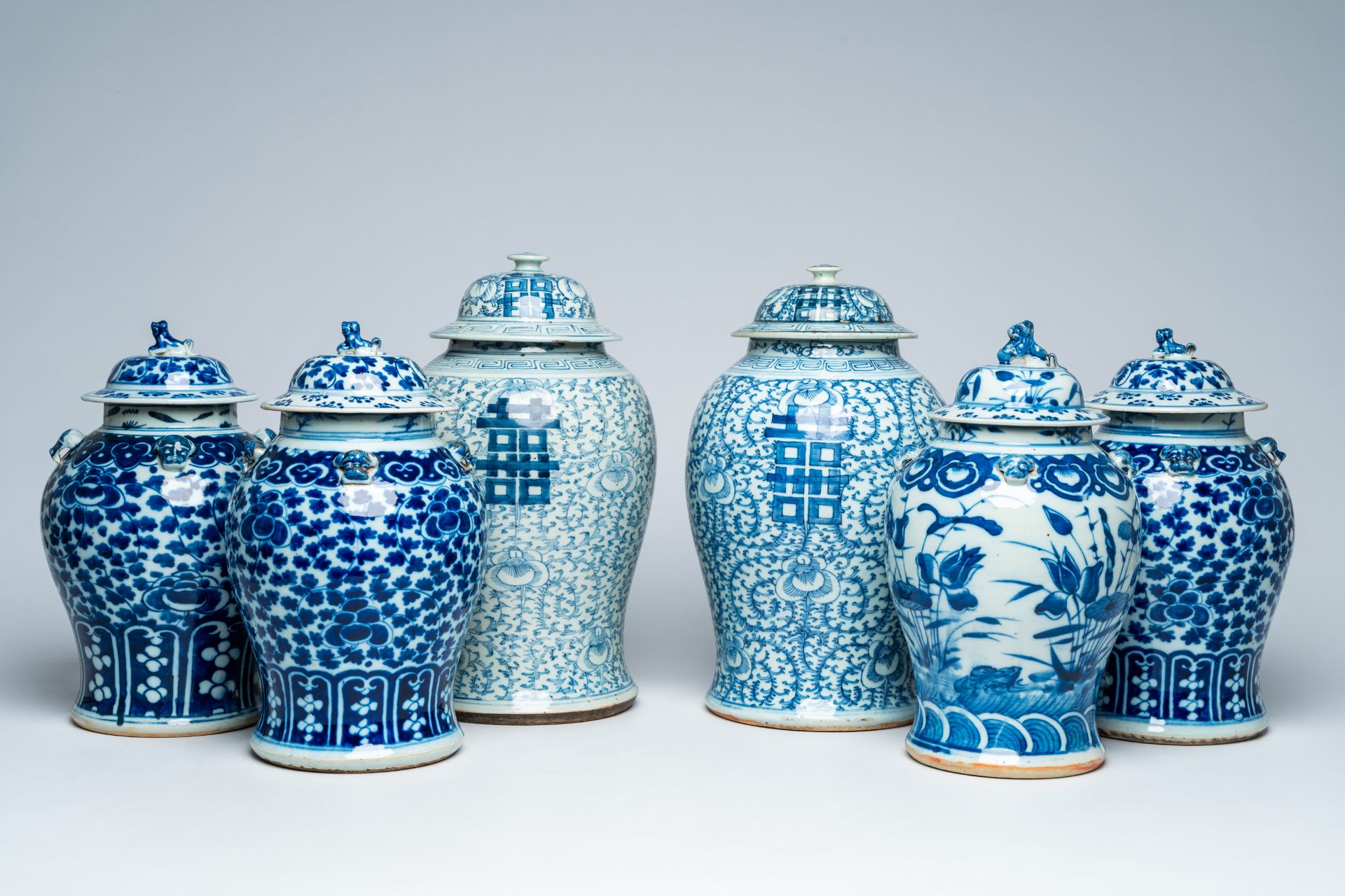 Six Chinese blue and white vases and covers with 'double happiness' and floral design, 19th/20th C.