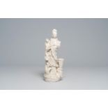 A Chinese Dehua blanc de Chine figure of Guanyin standing on a sea dragon, 20th C.