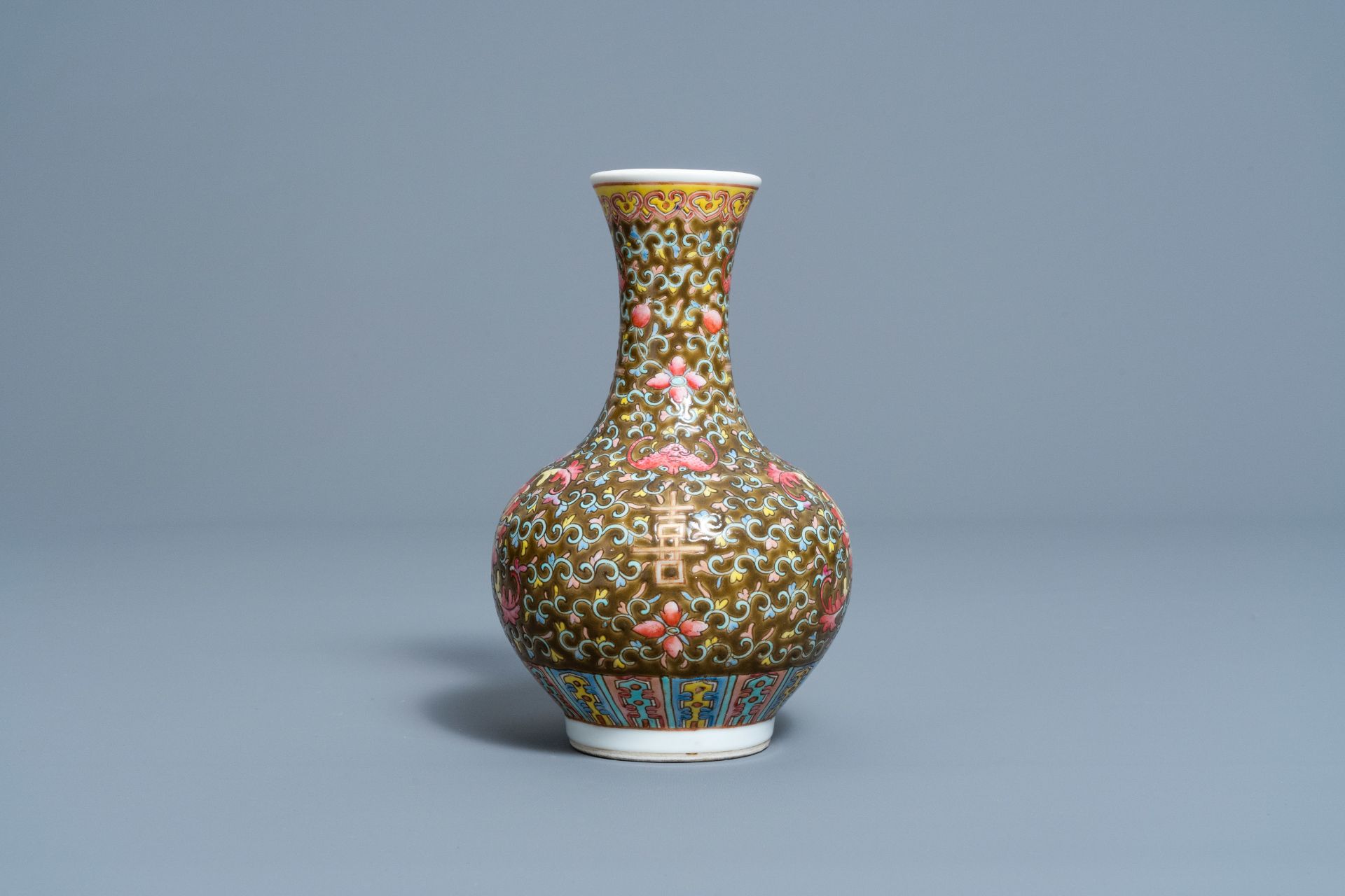 A Chinese famille rose brown ground vase with floral design, 'Happiness' mark, 19th/20th C.