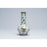 A Chinese famille verte vase with floral design, 19th C.