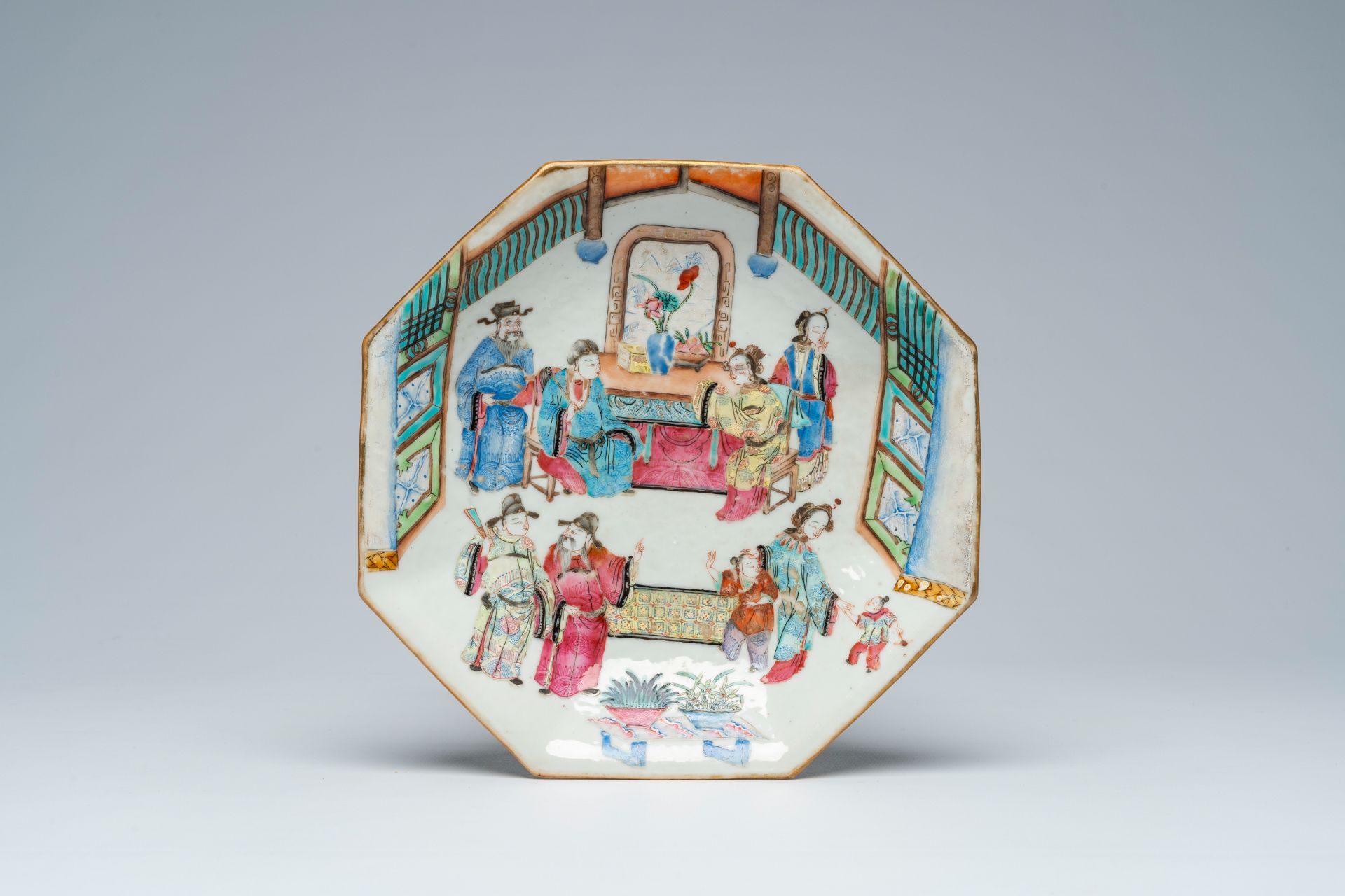 An octagonal Chinese famille rose bowl on foot with an animated palace scene, Tongzhi mark and of th