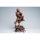 A Chinese rootwood 'Immortal' figure, 19th/20th C.