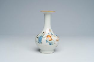 A Chinese bottle vase with scholars playing go in a garden, 19th C.
