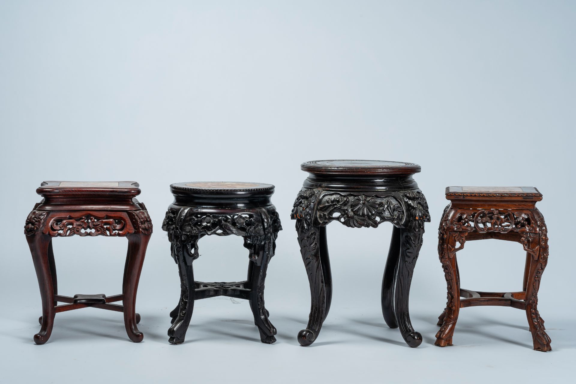 Four Chinese and Japanese open worked carved wood stands with marble and wood top, 20th C. - Image 3 of 7