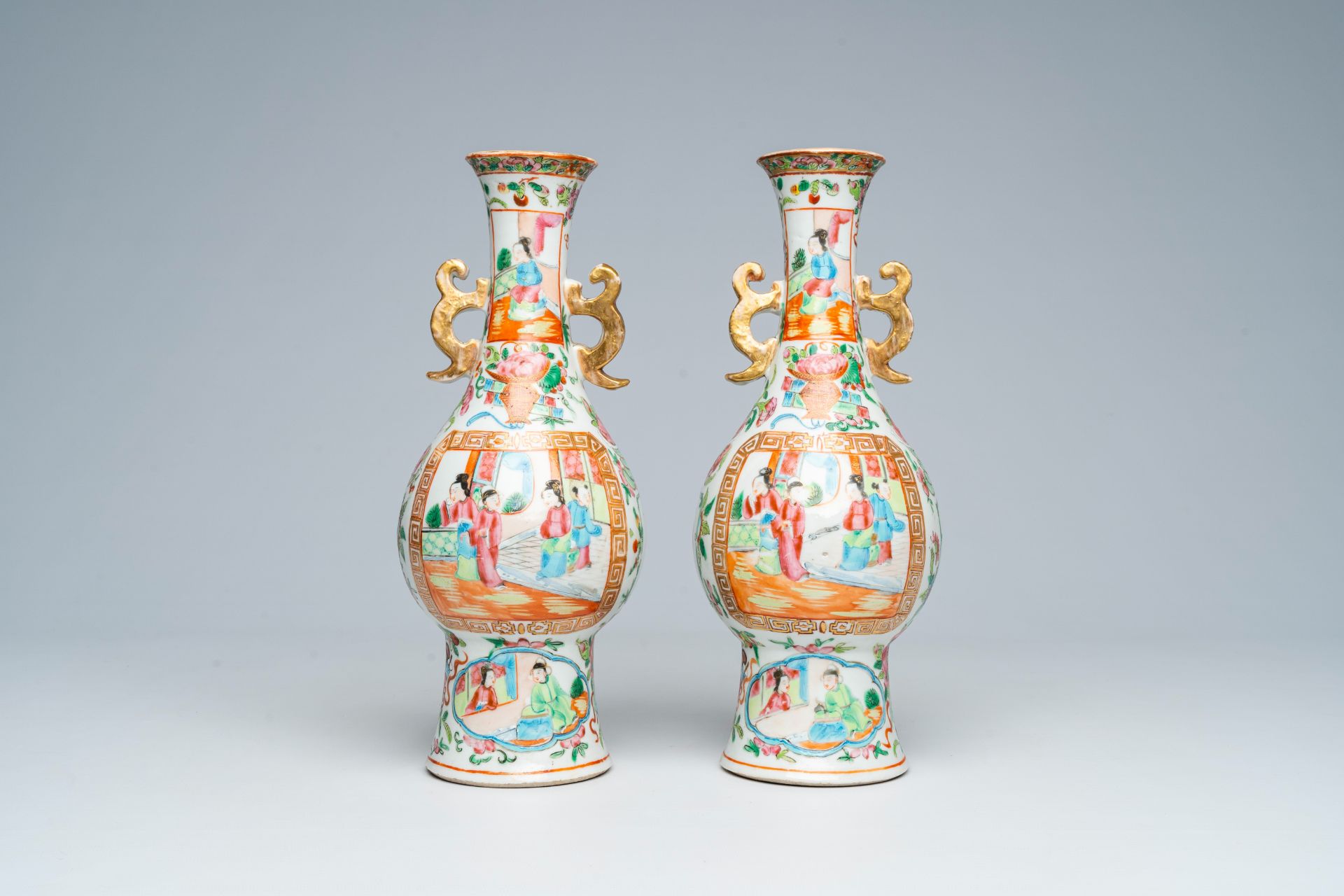 A pair of Chinese Canton famille rose vases and with palace scenes and floral design, 19th C. - Image 3 of 6