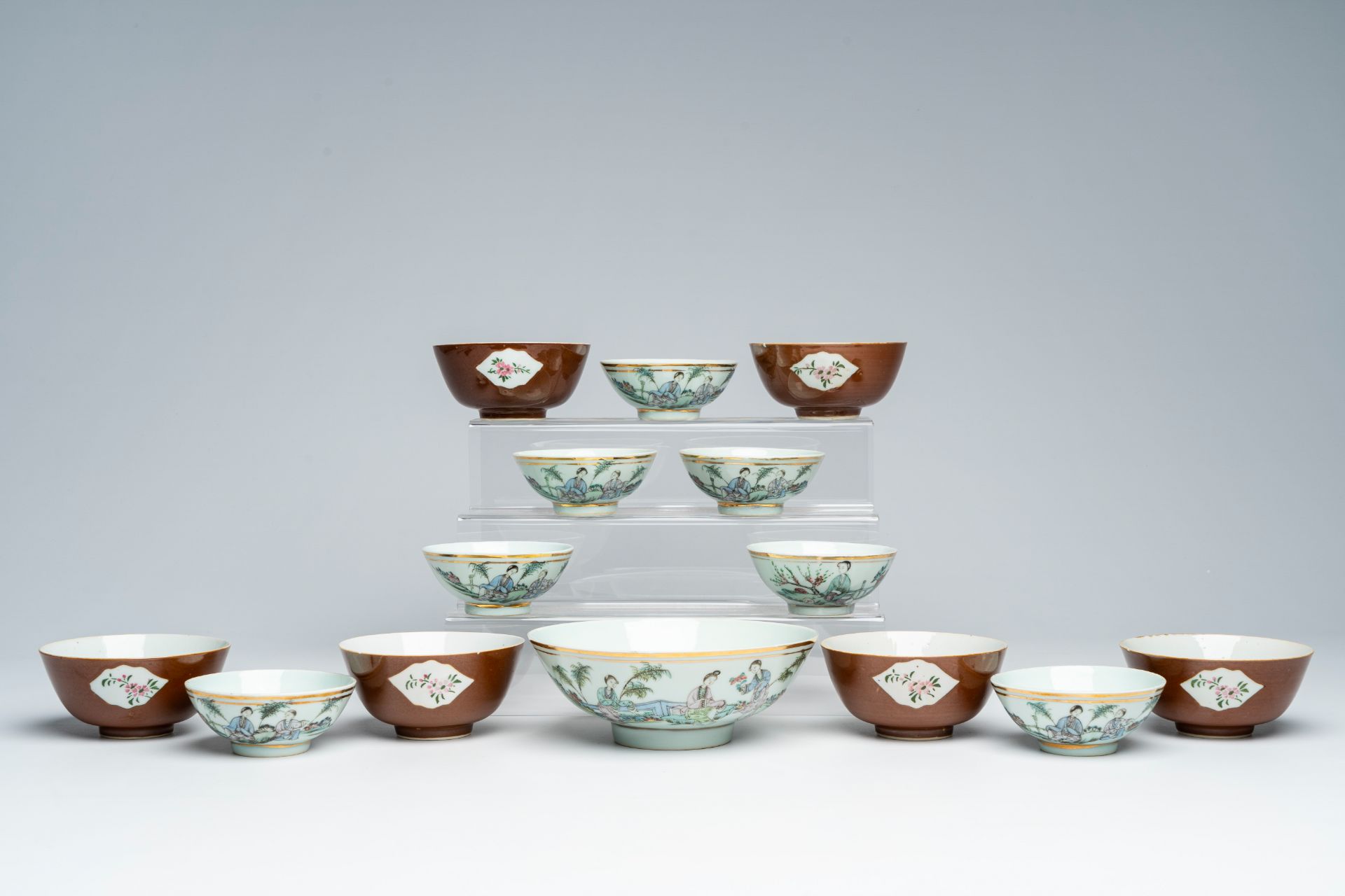 A varied collection of Chinese qianjiang cai and famille rose bowls with floral design and figures i