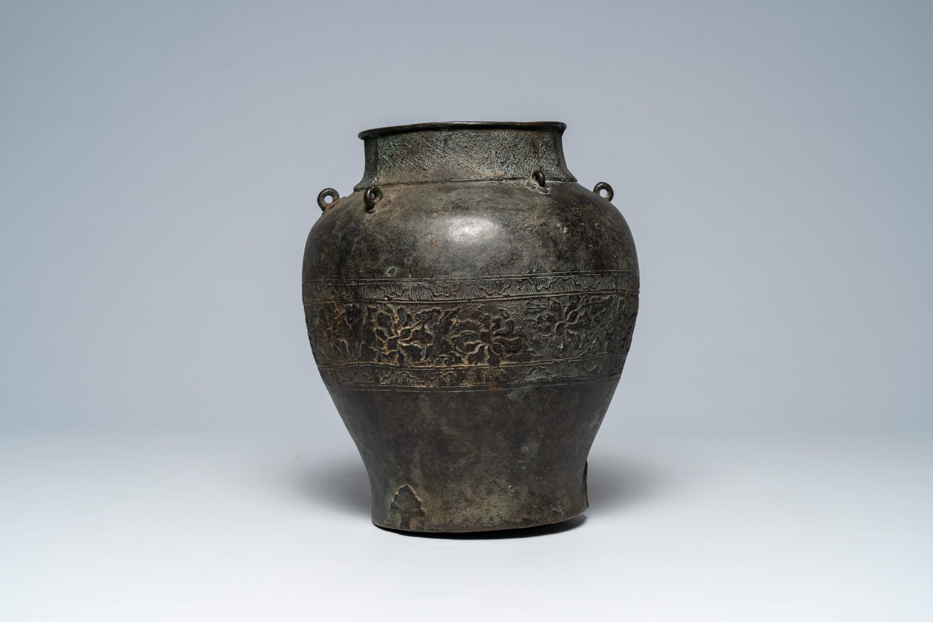 A Japanese or Korean bronze vase with floral relief frieze, probably 17th/18th C.